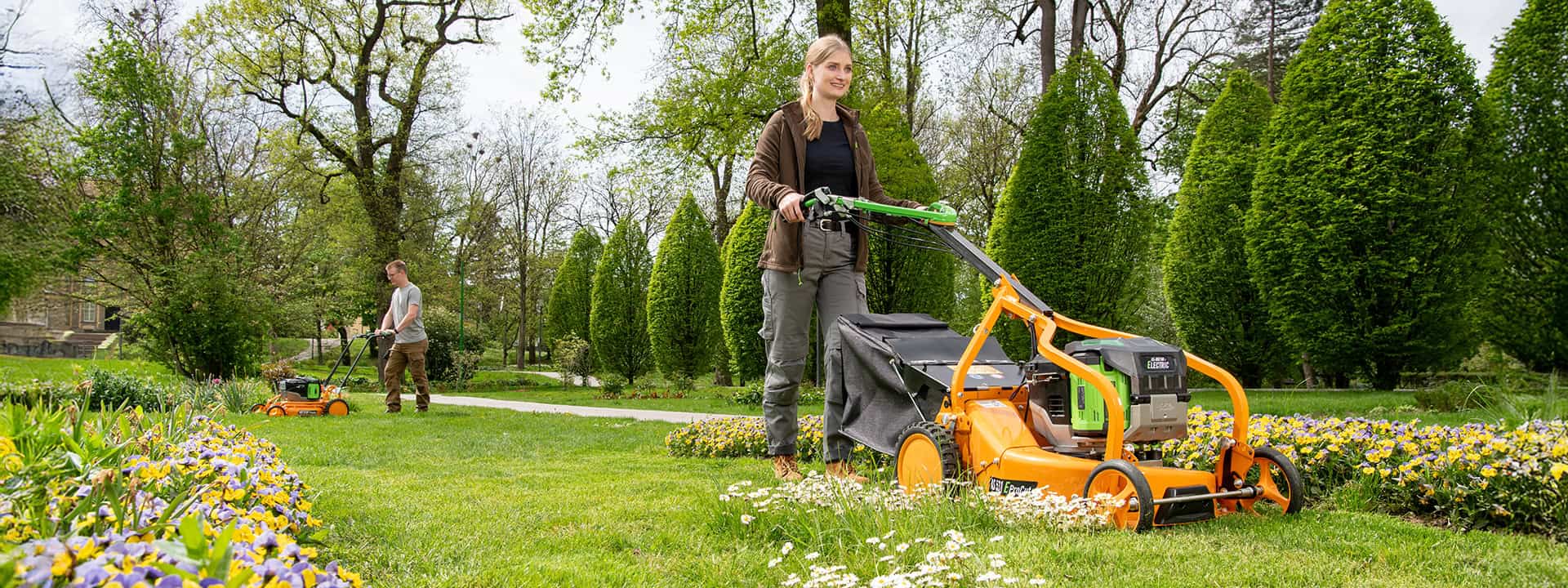 Man using an AS-Motor professional push mower, AS 531 Pro-Clip, mowing high gras on steep slopes