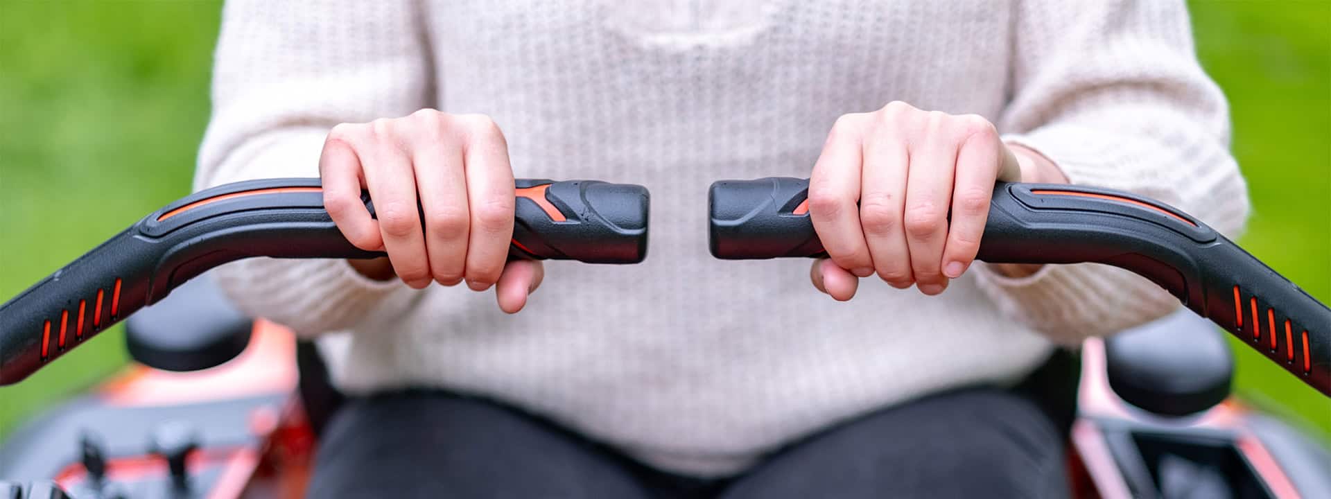 Top down shot of the Ariens Zero-Turn handle bars, showcasing the steering with a Zero-Turn mower