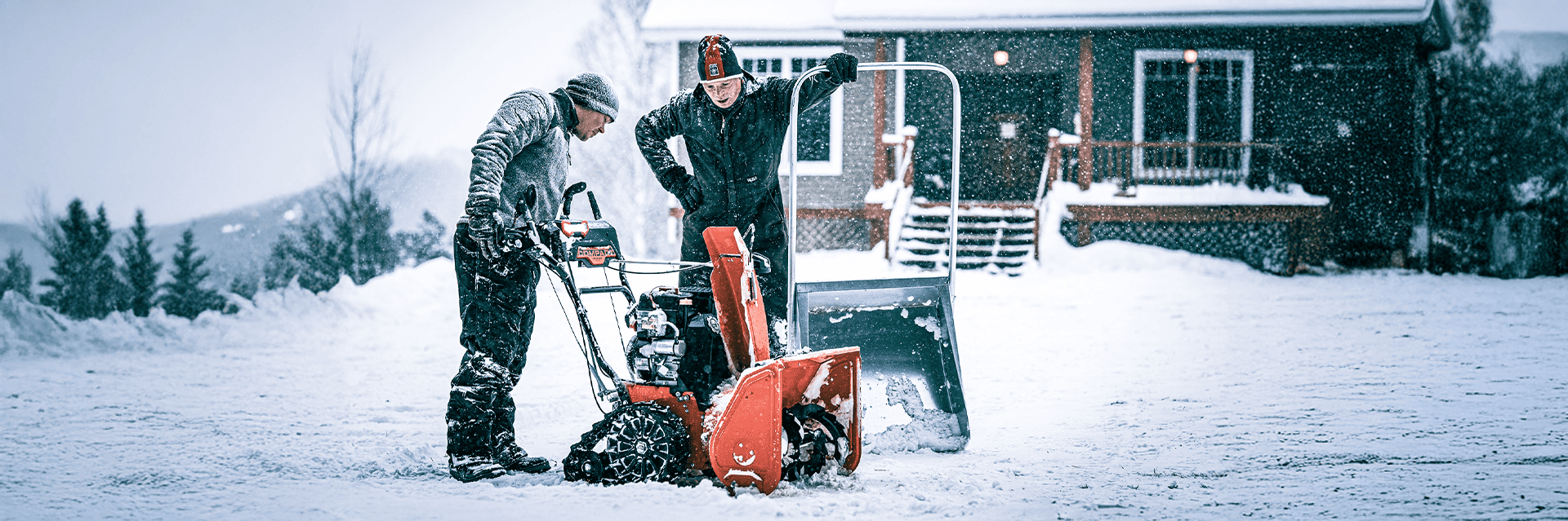 Homeowner using a snow blower in heavy snow