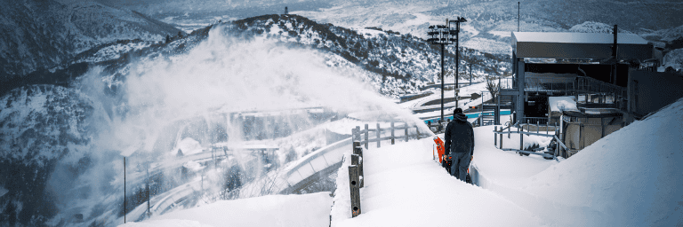 Snow blower clearing snow in Scandinavian winte