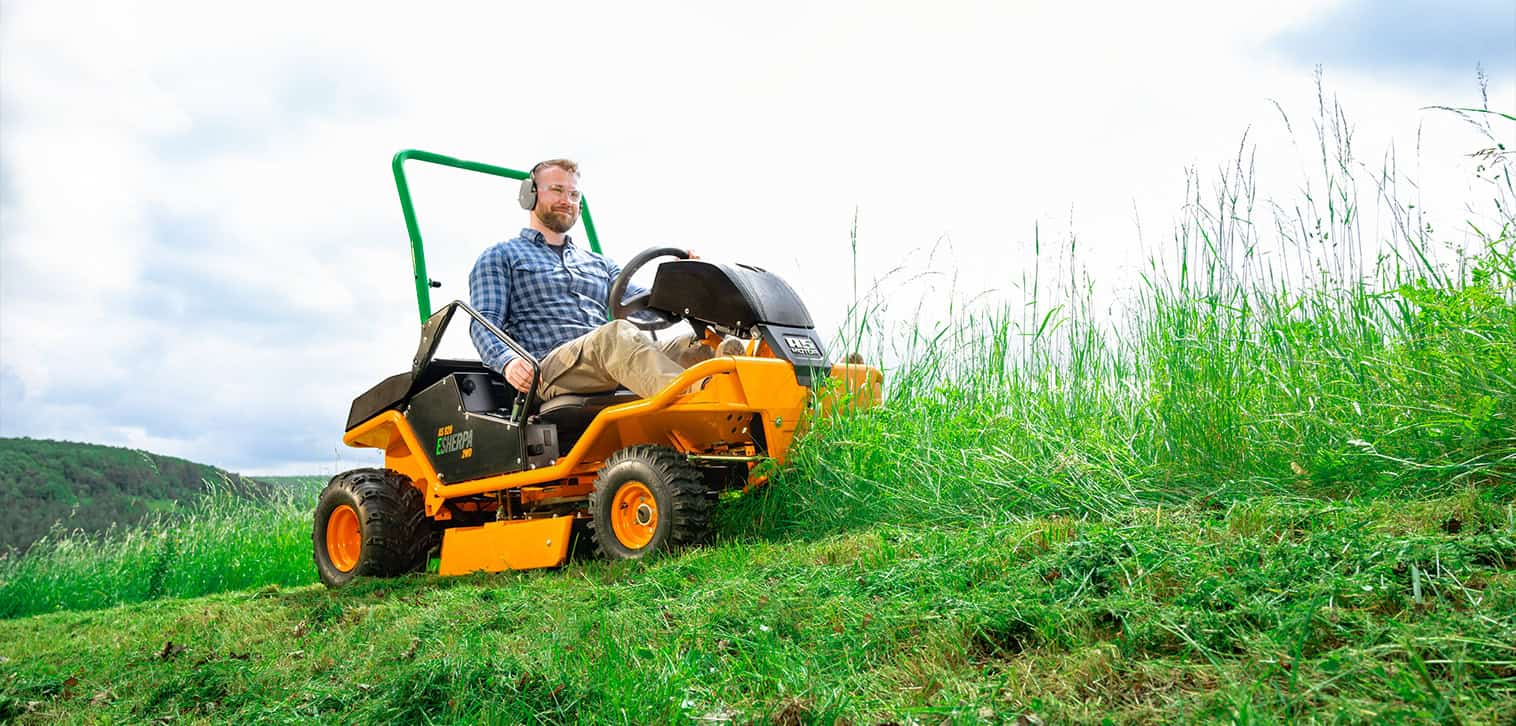 AS-Motor E-Sherpa 2WD mowing steep slopes of gras lawn